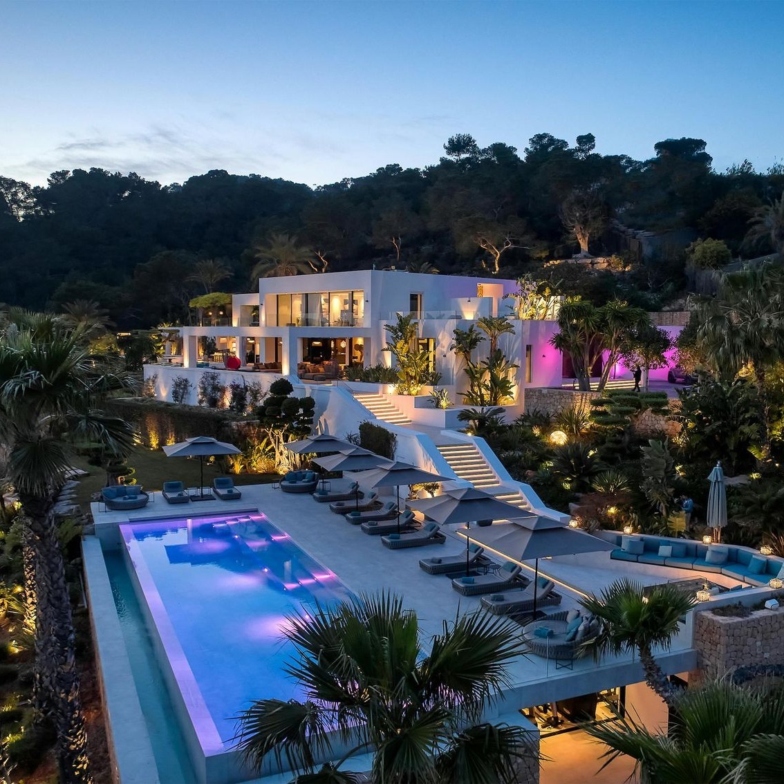 Luxury private villa with pool at twilight